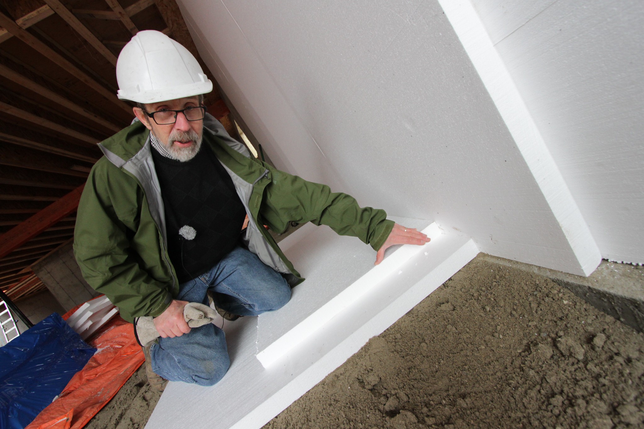 Peter Amerongen shows how Habitat Studio uses foam insulation to insulate basement concrete pads